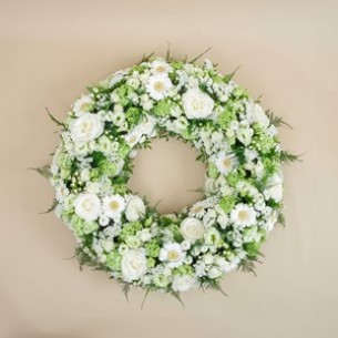 Funeral wreath in white t..