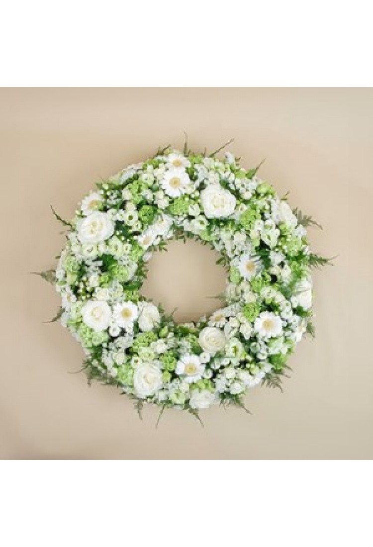 Funeral wreath in white t..