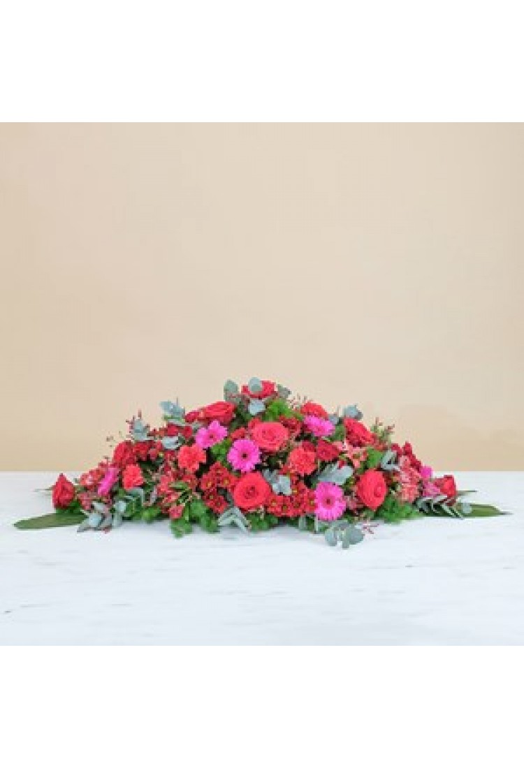 Coffin cover with red ros..